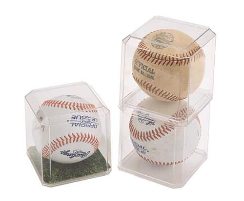 three baseball display cases stacked next to one another