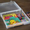 scrapbook storage display case with kids books and coloring crayons inside