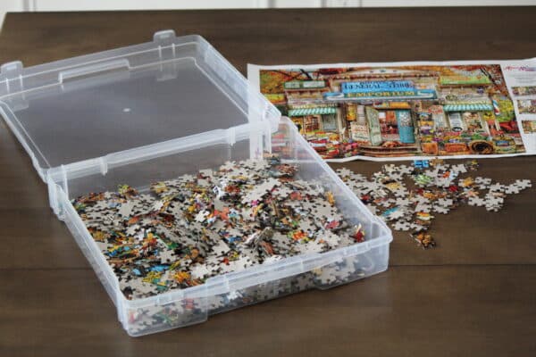 Scrapbook storage case holding puzzle pieces