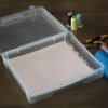 Scrapbook storage case with scrapbooking supplies in it