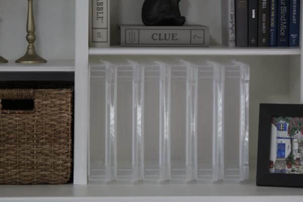 Scrapbook storage case stacked upright on a bookshelf