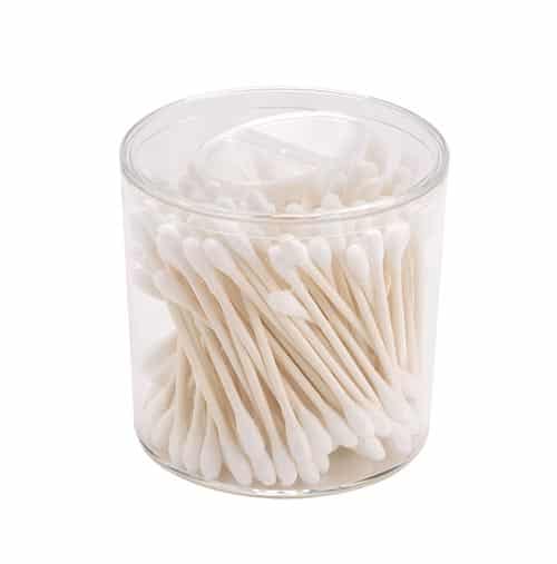 Clear container filled with cotton swabs for personal care and hygiene.