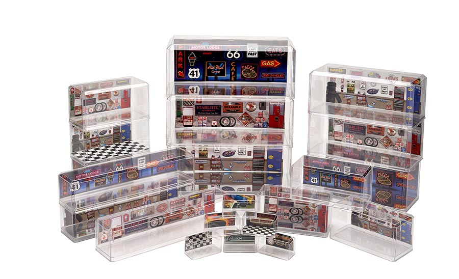 Colorful vintage road signs and memorabilia displayed in clear acrylic boxes.