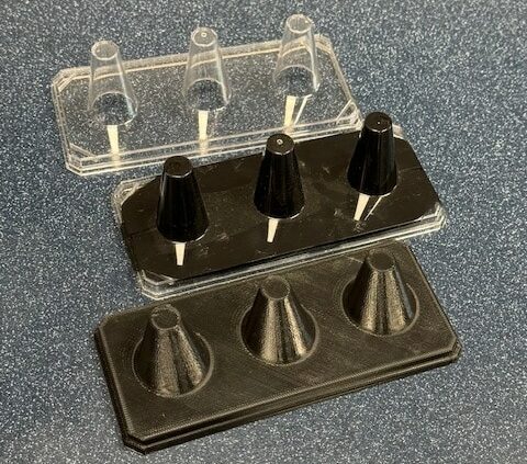 Various plastic cone molds for baking and crafting projects.