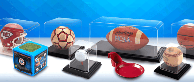 Diverse sports memorabilia displayed in protective cases, featuring balls and collectibles.