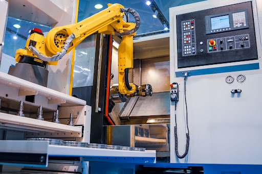 Automated robotic arm setup in a modern manufacturing machine environment.