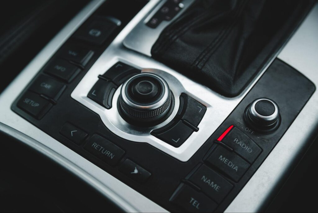 Sleek car control panel featuring advanced audio and navigation buttons.