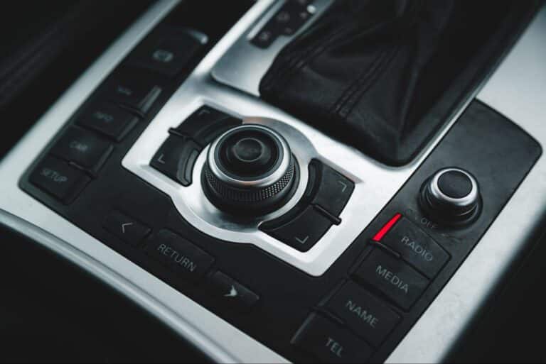 Sleek car control panel featuring advanced audio and navigation buttons.