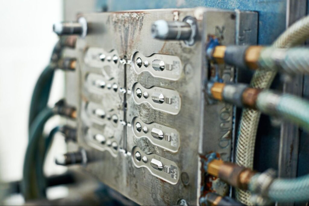 Industrial machinery with connected hoses and metal components for efficient operations.