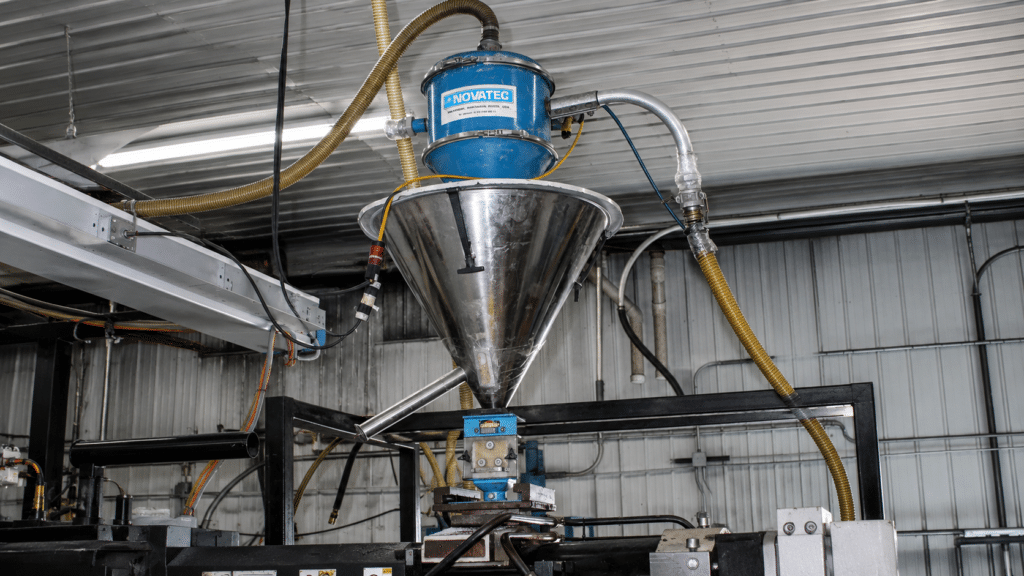 Industrial hopper feeder for efficient material processing in manufacturing facility.