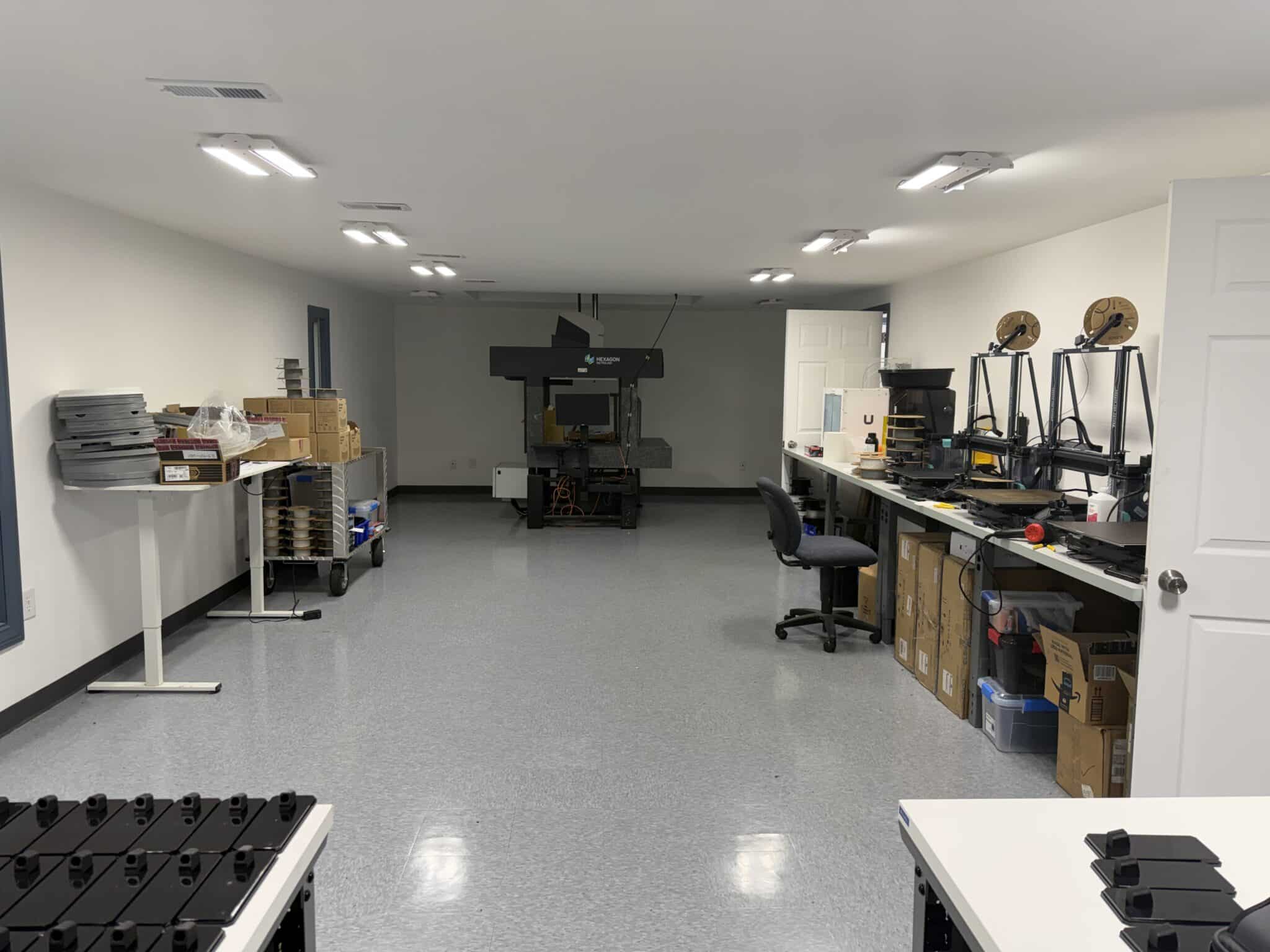 Pioneer Plastics industrial lab workspace with inspection and prototyping stations